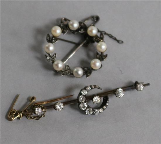An Edwardian gold, silver and diamond set crescent bar brooch and a cultured pearl and diamond circular brooch.